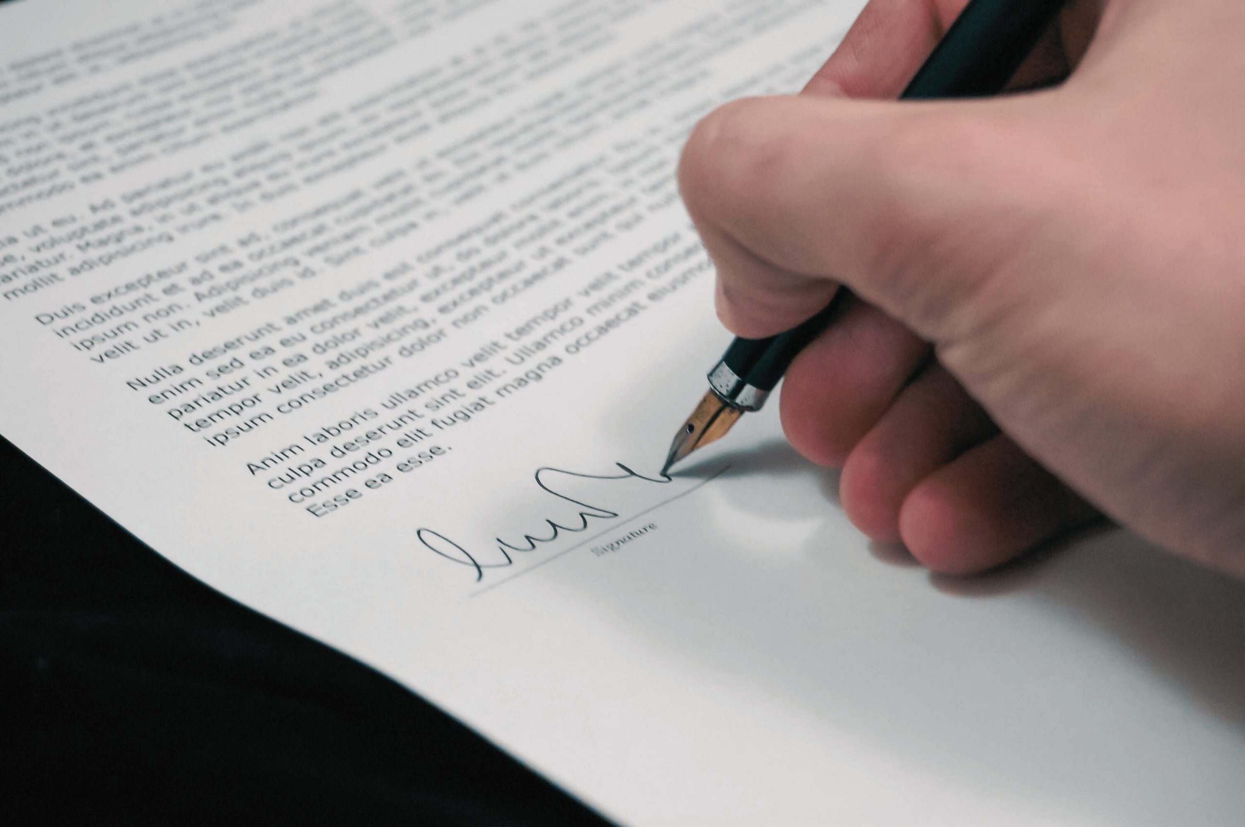 Image of a person signing